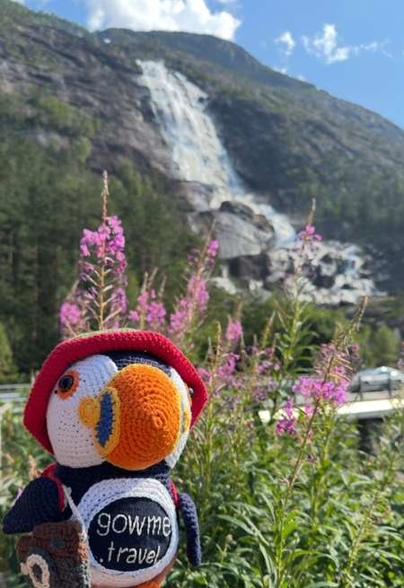 Langfossen, Western Norway — Large waterfall with powerful movement and scenic lower spillway in a pastoral mountain setting