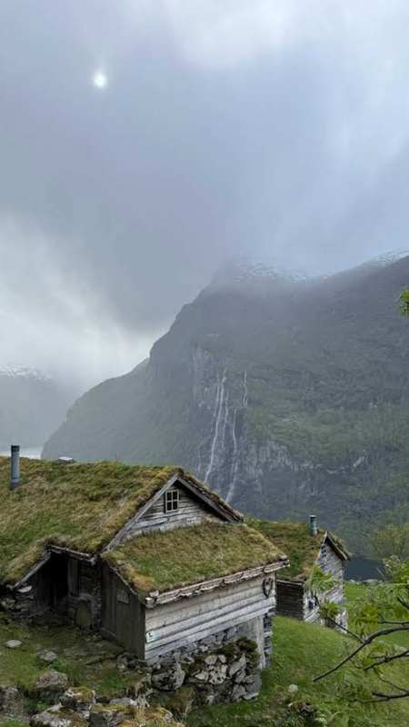 Skageflå + Seven Sisters waterfall, Northern Norway — Abandoned mountain farm on Geirangerfjord, accessible by hiking trail or boat, offering spectacular fjord views.
