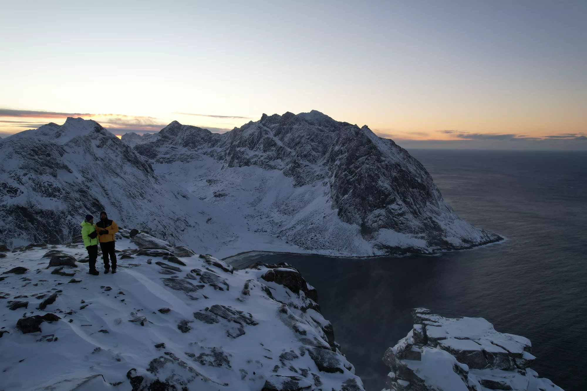 The Gowme.travel team on the snowy ridge above Kvalvika on our winter hike to Ryten, Lofoten